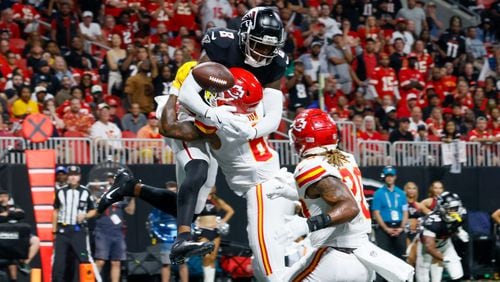 Atlanta Falcons tight end Kyle Pitts cannot grab the ball at the end zone  as he is hit by the Kansas City Chief's Bryan Cook during the fourth quarter on Sunday, Sept. 22, 2024, at Mercedes-Benz Stadium in Atlanta.  (Miguel Martinez/ AJC)