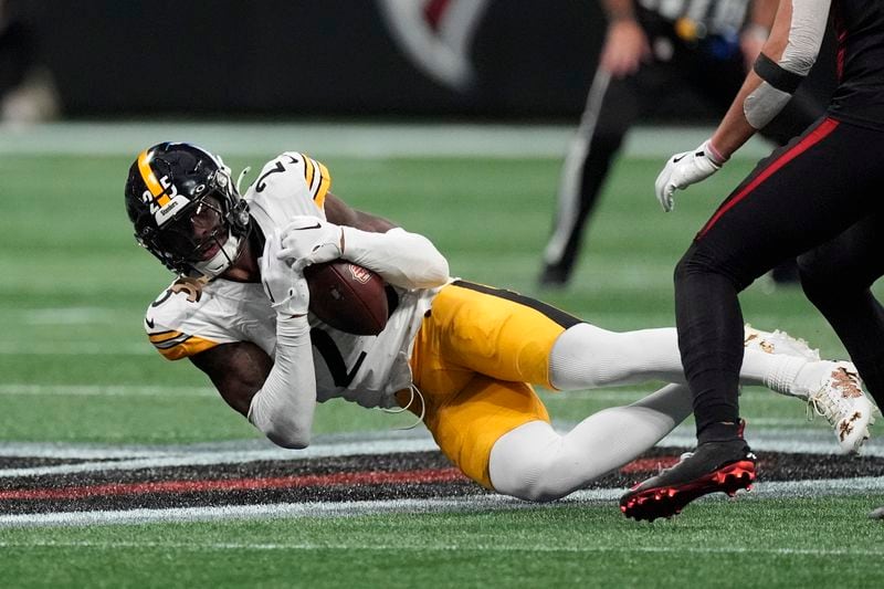 Pittsburgh Steelers safety DeShon Elliott intercepts a pass during the first half of an NFL football game against the Atlanta Falcons on Sunday, Sept. 8, 2024, in Atlanta. (AP Photo/John Bazemore)