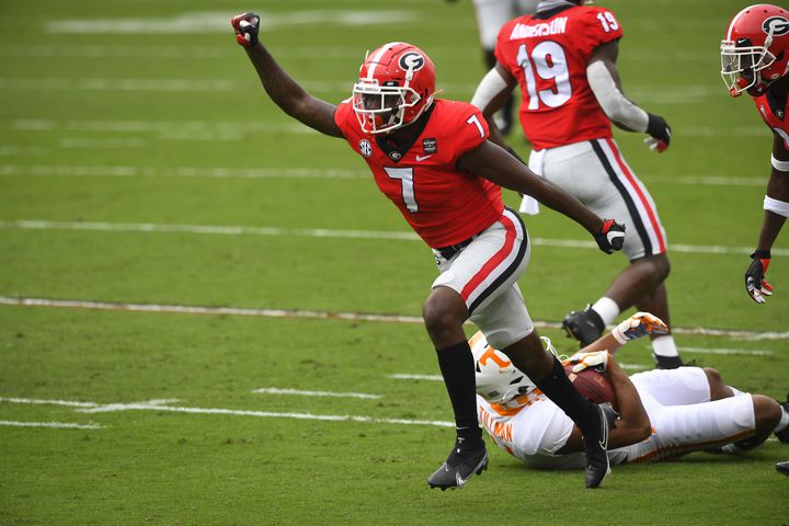 Georgia defensive back Tyrique Stevenson (7) celebrates tackling Tennessee wide receiver Cedric Tillman during the first half of a football game Saturday, Oct. 10, 2020, at Sanford Stadium in Athens. Georgia won 44-21. JOHN AMIS FOR THE ATLANTA JOURNAL- CONSTITUTION