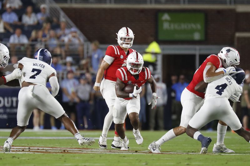 Mississippi running back Matt Jones (0) runs the ball during the first half of an NCAA college football game against Georgia Southern, Saturday, Sept. 21, 2024, in Oxford, Miss. AP Photo/Sarah Warnock)