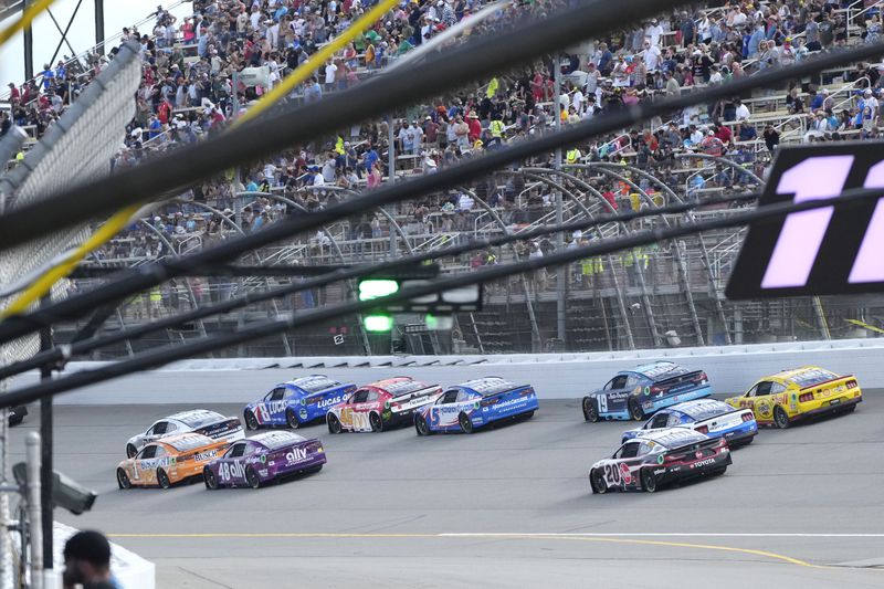 Drivers drive during a NASCAR Cup Series auto race at Michigan International Speedway, Sunday, Aug. 18, 2024, in Brooklyn, Mich. (AP Photo/Carlos Osorio)