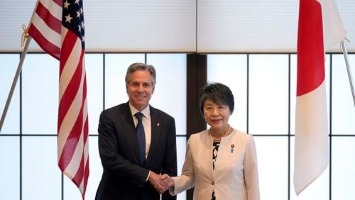 U.S. Secretary of State Antony Blinken, left, and Japanese Foreign Minister Yoko Kamikawa shake hands before their bilateral meeting at the Foreign Ministry's Iikura guesthouse in Tokyo, Sunday, July 28, 2024. (AP Photo/Hiro Komae)