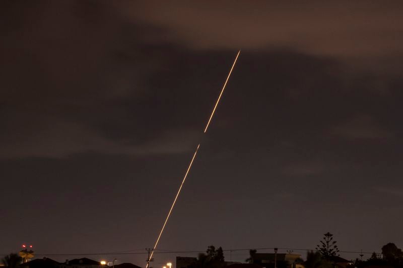 Israeli air defense system fires to intercept rockets fired from Iran, Tuesday, Oct. 1, 2024, over Hadera, Israel. (AP Photo/Ariel Schalit)