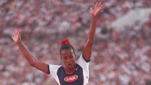 Jackie Joyner-Kersee of the U.S. women's track and field team is airborne for jump #2 in Long jump competition at the Olympic stadium Friday, Aug. 2, 1996, during the 1996 Summer Olympic Games in Atlanta, Georgia. (Karen Waren/AJC)