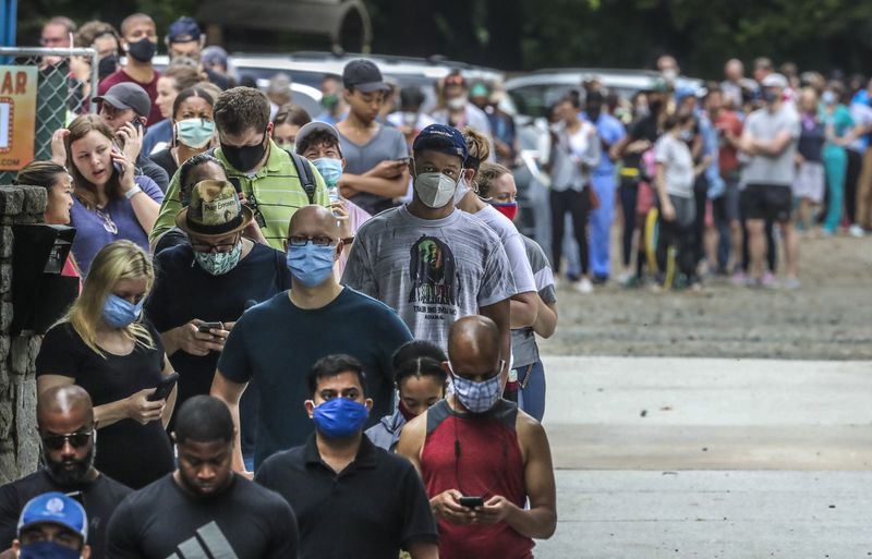 Voters had a long wait, some two to three hours, at the Park Tavern polling place on Tuesday, June 9, 2020 in Atlanta. (John Spink/Atlanta Journal-Constitution/TNS)