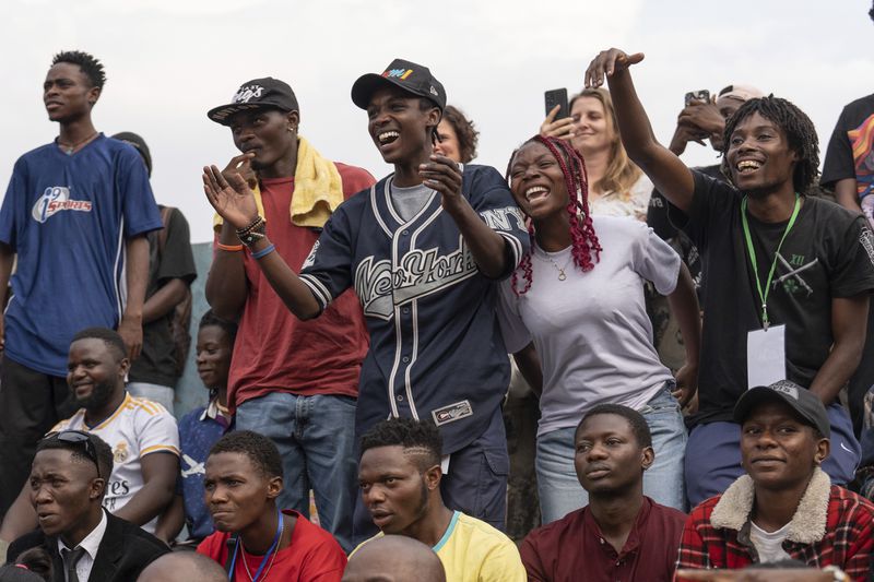 Spectators look at a dance performance in Goma, Democratic Republic of the Congo, Saturday, June 15, 2024, during the annual Goma Dance Festival. (AP Photo/Moses Sawasawa)