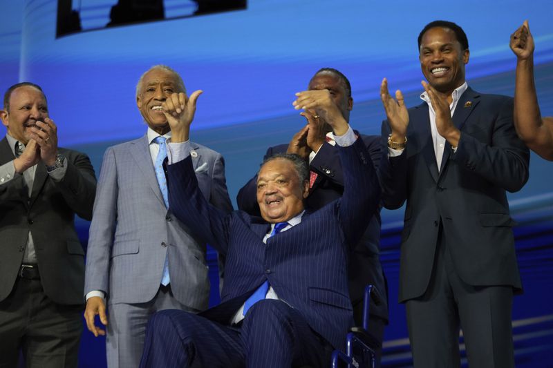 Rev. Jesse Jackson gestures during the Democratic National Convention Monday, Aug. 19, 2024, in Chicago. (AP Photo/Paul Sancya)