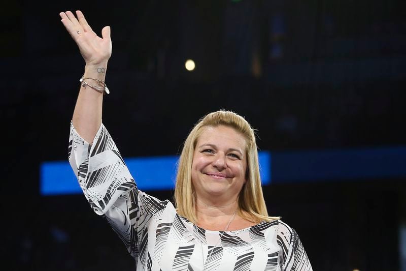FILE -Aimee Boorman gestures at the U.S. gymnastics championships, Sunday, Aug. 20, 2017, in Anaheim, Calif. Boorman, who coached Simone Biles to gold at the 2016 Olympics, is a co-founder of the Global Impact Gymnastics Alliance, a start-up professional league that hopes to begin holding events in 2025. (AP Photo/Ringo H.W. Chiu, File)