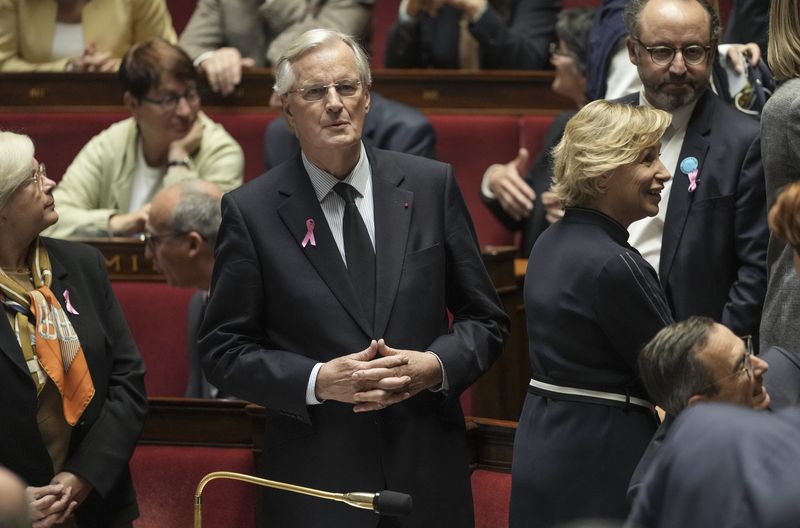 France's Prime Minister Michel Barnier arrives at the National Assembly, in Paris, Tuesday, Oct. 1, 2024. (AP Photo/Thibault Camus)