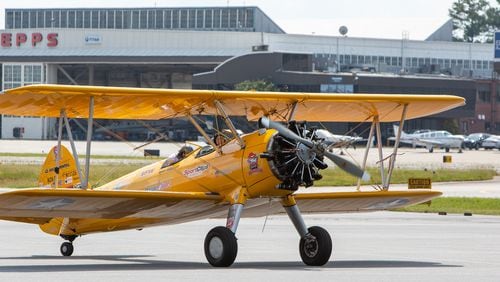 Ninety-eight-year-old World War II veteran Ken Will & Pilot John P. Cyrier taxi after a ride in a 1943 Boeing Stearman bi-plane at PDK Airport. PHIL SKINNER FOR THE ATLANTA JOURNAL-CONSTITUTION.