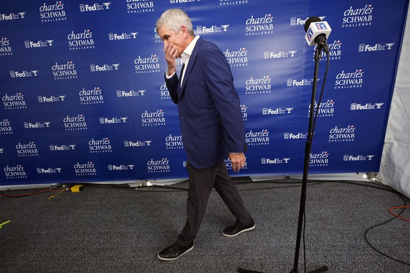 PGA Tour Commissioner Jay Monahan walks away from the microphone after talking about the death of PGA player Grayson Murray during the Charles Schwab Challenge golf tournament at Colonial Country Club in Fort Worth, Texas, Saturday, May 25, 2024. (AP Photo/LM Otero)