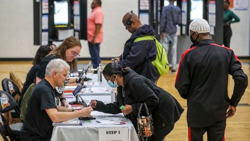 Counties will begin using GaRVIS, a new voter registration system, on Feb. 6. State Election Director Blake Evans says that when combined with a streamlined early voting check-in process, GaRVIS will eliminate the need for voters to fill out paper forms, average check-in times are expected to drop from about three minutes to 50 seconds. (John Spink / John.Spink@ajc.com)