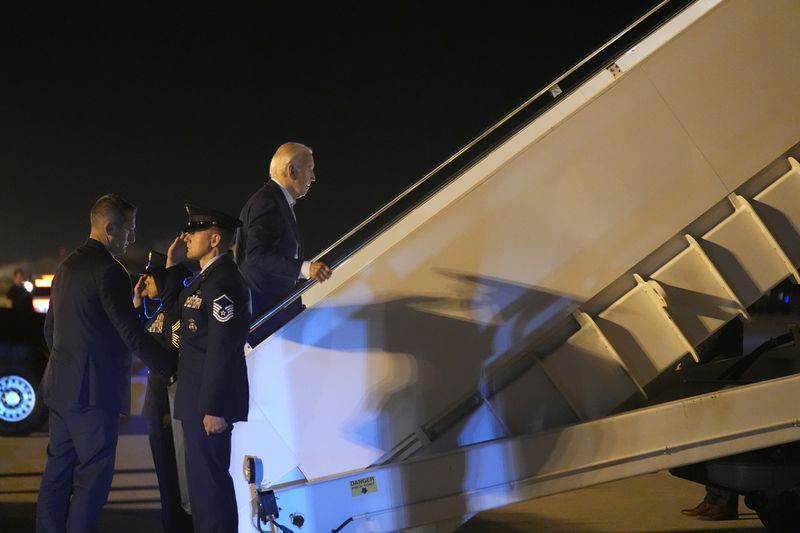 President Joe Biden boards Air Force One at Dover Air Force Base, in Dover, Del., Saturday, July 13, 2024. President Biden is returning to Washington earlier than planned following the attack at the Trump rally in Pennsylvania. (AP Photo/Manuel Balce Ceneta)