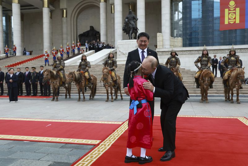 Russian President Vladimir Putin, right, and Mongolian President Ukhnaagiin Khurelsukh attend a welcoming ceremony at Sukhbaatar Square in Ulaanbaatar, Mongolia, Tuesday, Sept. 3, 2024. (Vyacheslav Prokofyev, Sputnik, Kremlin Pool Photo via AP)