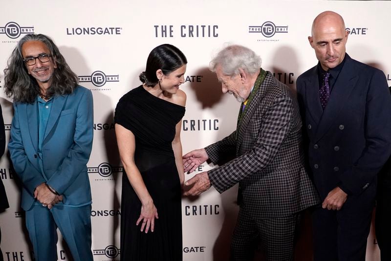 Ian McKellen, centre right, with Gemma Arterton, centre left, as they pose for photographers upon arrival at the European Premiere of the The Critic, In London, Monday, Sept. 2, 2024. (AP Photo/Alberto Pezzali)