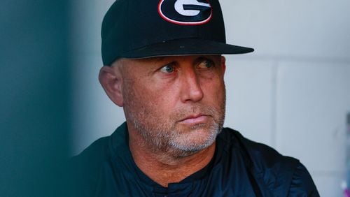Georgia coach Wes Johnson watches his team jump onto the field moments before the game against the Florida Gators at Foley Field on Tuesday, May 16, 2024, in Athens. (Miguel Martinez / AJC)
