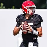 Georgia quarterback Carson Beck (15) looks for a receiver during the Bulldogs’ practice Tuesday, Aug. 24, 2021, in Athens. (Tony Walsh/UGA)