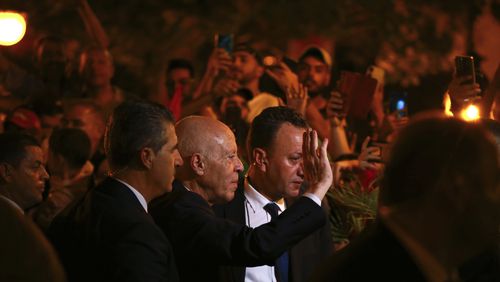 Tunisian president and candidate for re-election Kais Saied joins his supporters after the announcement of the provisional results for the presidential elections, in the capital Tunis, Tunisia, Sunday, Oct. 6, 2024. (AP Photo/Anis Mili)