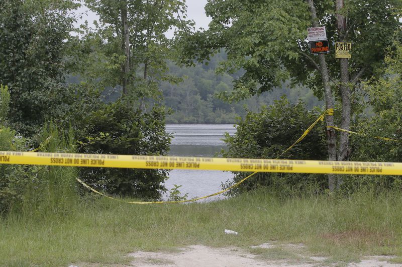 The body of a man was recovered from Lake Carlton near Loganville after neighbors spotted it about 8:15 p.m. Wednesday. BOB ANDRES / BANDRES@AJC.COM