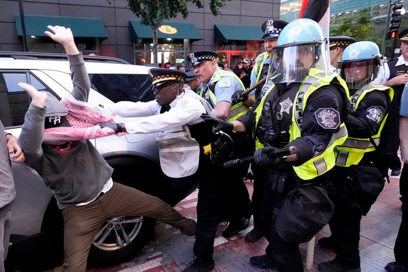 Demonstrators clash with police near the Israeli Consulate during the Democratic National Convention Tuesday, Aug. 20, 2024, in Chicago. (AP Photo/Alex Brandon)