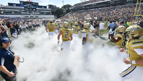 Georgia Tech's Ramblin' Wreck leads the band, cheerleaders, Buzz, players, and coaches before the start of the Georgia Tech home game against Ole Miss in an NCAA college football game at Georgia Tech's Bobby Dodd Stadium in Atlanta on Saturday, September 17, 2022. (Hyosub Shin / Hyosub.Shin@ajc.com)