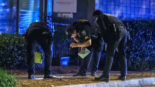 Atlanta police investigate a fatal shooting outside a northwest Atlanta barber shop Wednesday morning.