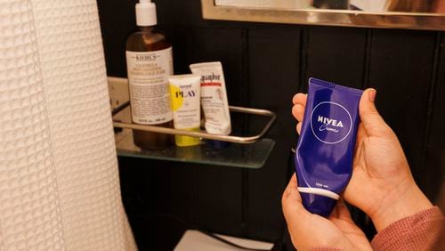 Scarlett Goddard Strahan, 11, displays her Nivea moisturizer at her home on Tuesday, Aug. 20, 2024, in Sacramento, Calif. AP Photo/Juliana Yamada)