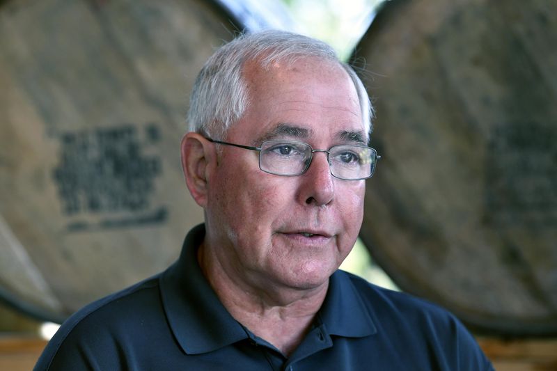 Eddie Russell, master distiller, and son of 89-year-old Jimmy Russell, the "Buddha of Bourbon" talks about having three generations of the Russell family involved in the bourbon industry at the Wild Turkey Distillery in Lawrenceburg, Ky., Wednesday, Aug. 28, 2024. (AP Photo/Timothy D. Easley)