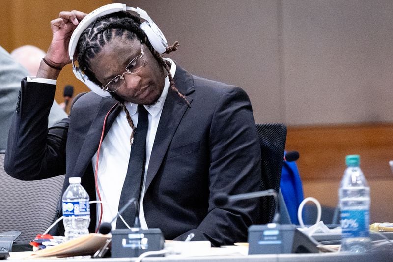 Atlanta rapper Young Thug, whose real name is Jeffery Williams, waits for the start of opening statements of his trial at Fulton County Courthouse Monday, Nov. 27, 2023.   (Steve Schaefer/steve.schaefer@ajc.com)