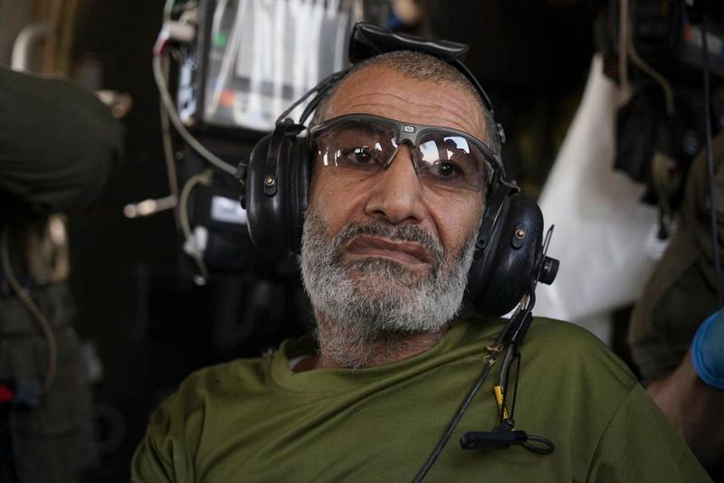 In this photo released by Israeli Defense Forces on Tuesday, Aug. 27, 2024, Qaid Farhan Alkadi sits on an Israeli military helicopter during the rescue operation. (Israeli Defense Forces via AP)