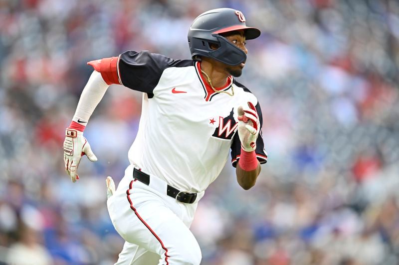 Washington Nationals' Darren Baker runs to first base on his first major league hit during the ninth inning of a baseball game against theChicago Cubs, Sunday, Sept. 1, 2024, in Washington. (AP Photo/John McDonnell)