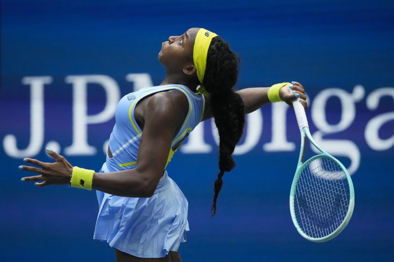 Coco Gauff, of the United States, serves shot to Emma Navarro, of the United States, during the fourth round of the U.S. Open tennis championships, Sunday, Sept. 1, in New York. 2024. (AP Photo/Pamela Smith)