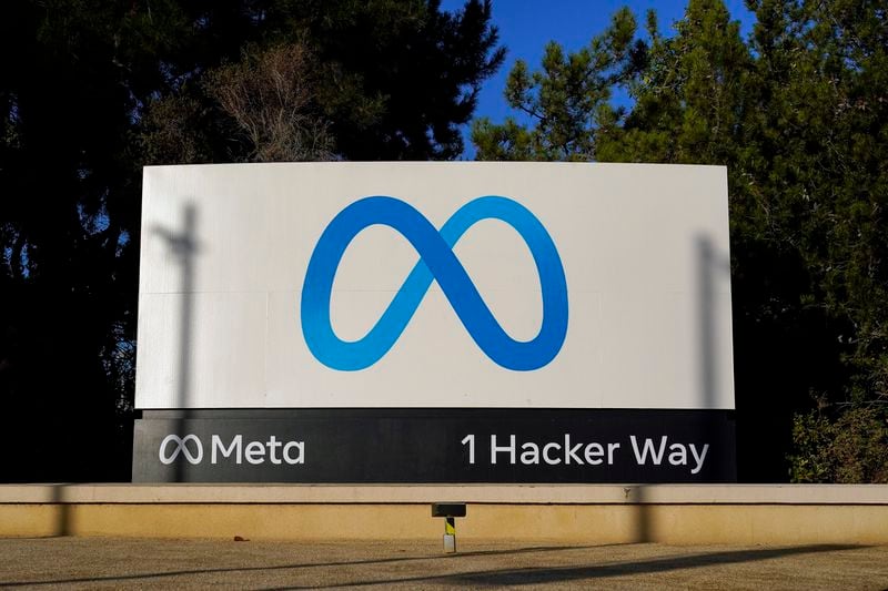 FILE - Meta's logo is seen on a sign at the company's headquarters in Menlo Park, Calif., Nov. 9, 2022. The United States signed a memorandum with several of the world’s biggest social media companies on Thursday, July 11, 2024, including Meta, aimed at preventing the use of their platforms for the distribution of synthetic drugs. (AP Photo/Godofredo A. Vásquez, File)