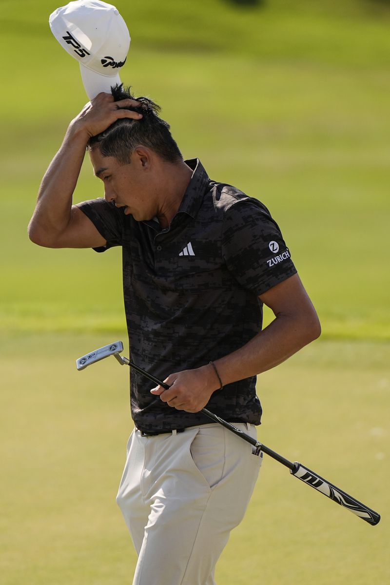 Collin Morikawa walks on the 18th green during the first round of the Tour Championship golf tournament, Thursday, Aug. 29, 2024, in Atlanta. (AP Photo/Mike Stewart)