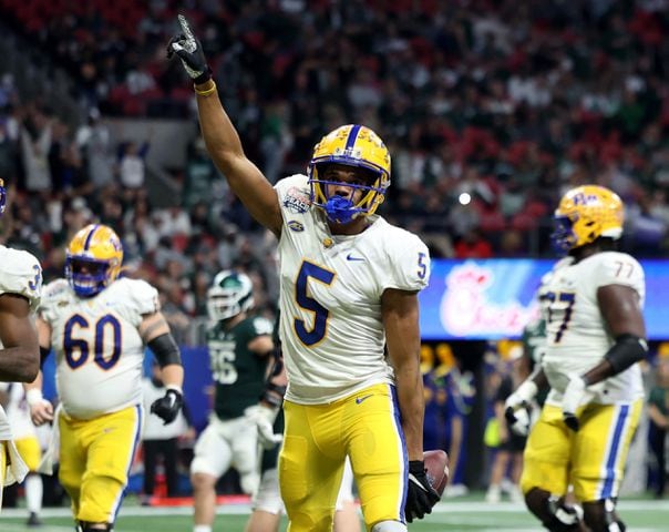 Pittsburgh Panthers wide receiver Jared Wayne (5) reacts after scoring a receiving touchdown during the first half against the Michigan State Spartans in the Chick-fil-A Peach Bowl at Mercedes-Benz Stadium in Atlanta, Thursday, December 30, 2021. JASON GETZ FOR THE ATLANTA JOURNAL-CONSTITUTION