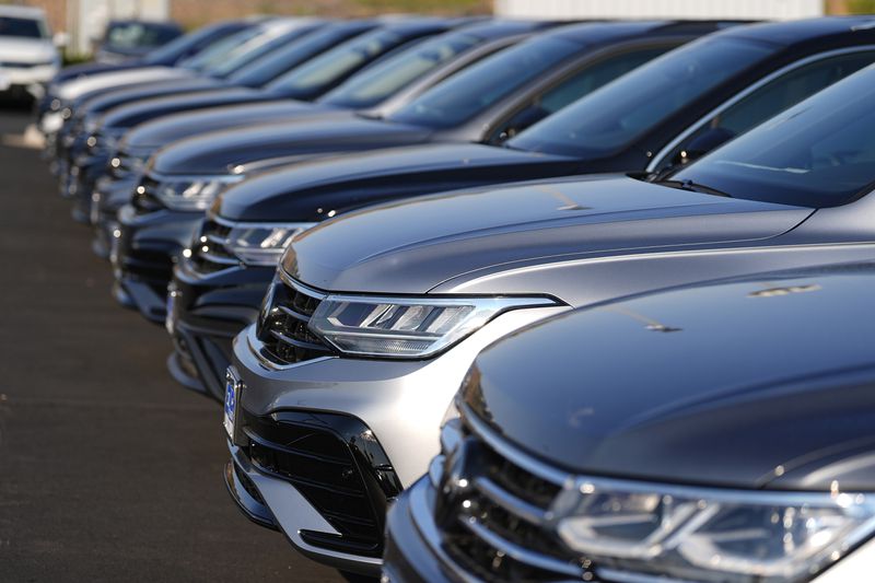 FILE - A row of unsold 2024 Tiguan utility vehicles are shown July 28, 2024, at a Volkswagen dealership in Denver. (AP Photo/David Zalubowski, File)