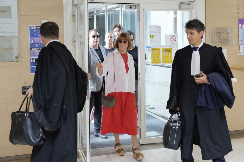 FILE - Gisele Pelicot, left, arrives in the Avignon court house, in Avignon, southern France, Thursday, Sept. 5, 2024. (AP Photo/Lewis Joly, File)