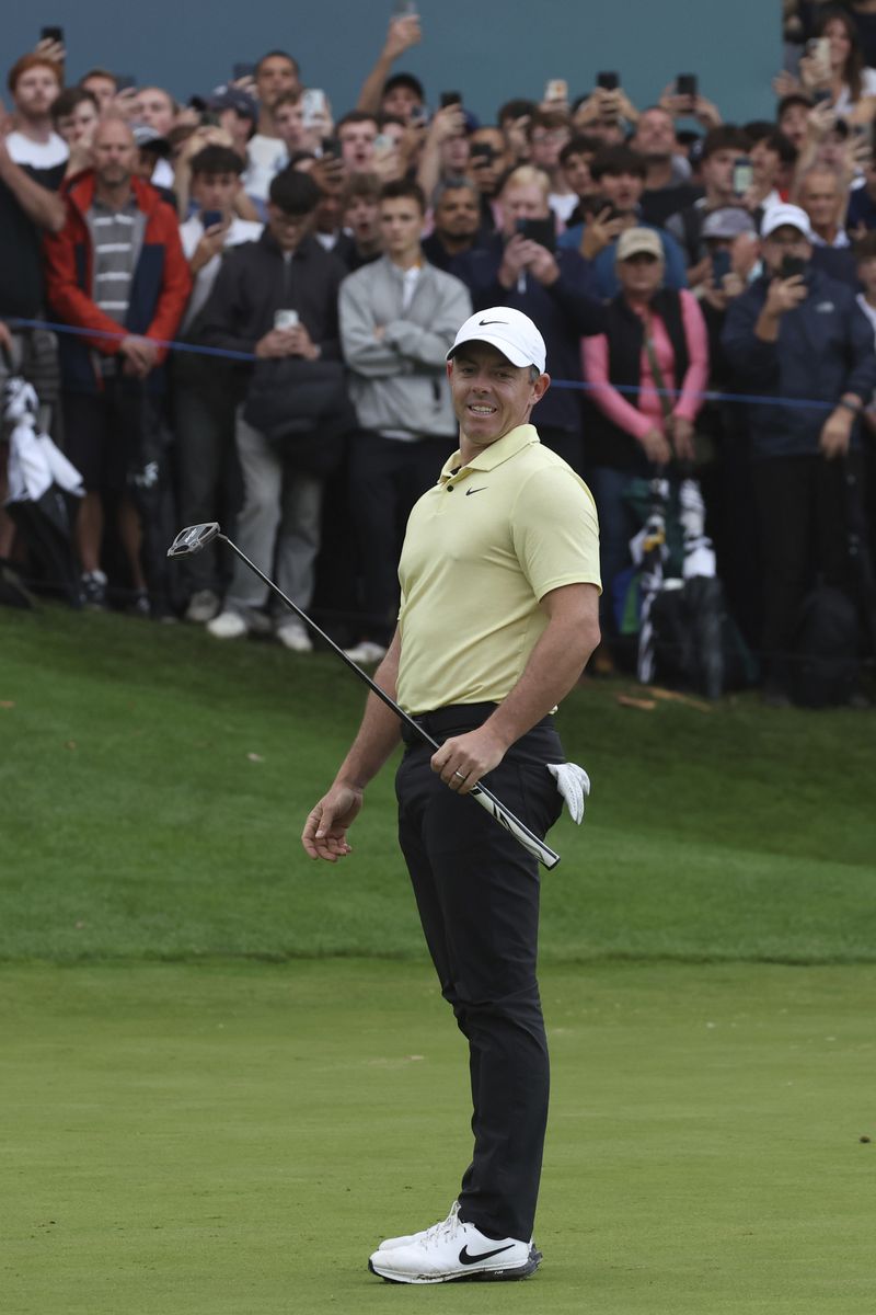 Rory McIlroy, of Northern Ireland, races after putting on the 18th green during a playoff for the British PGA golf Championship, which Billy Horschel of the United States won, at Wentworth golf club in Wentworth, England, Sunday, Sept. 22, 2024. (AP Photo/Ian Walton)