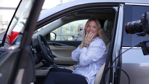 2025 Bibb County School District Teacher of the Year Sarah Mallett sits inside of her new car during the grand opening of Grand Infiniti on Saturday, Sept. 21, 2024, in Macon, Georgia. Mallett teaches at Howard Middle School and was awarded a year lease on a brand new Infiniti as a part of Grand Infiniti’s grand opening. (Photo Courtesy of Katie Tucker/The Telegraph)