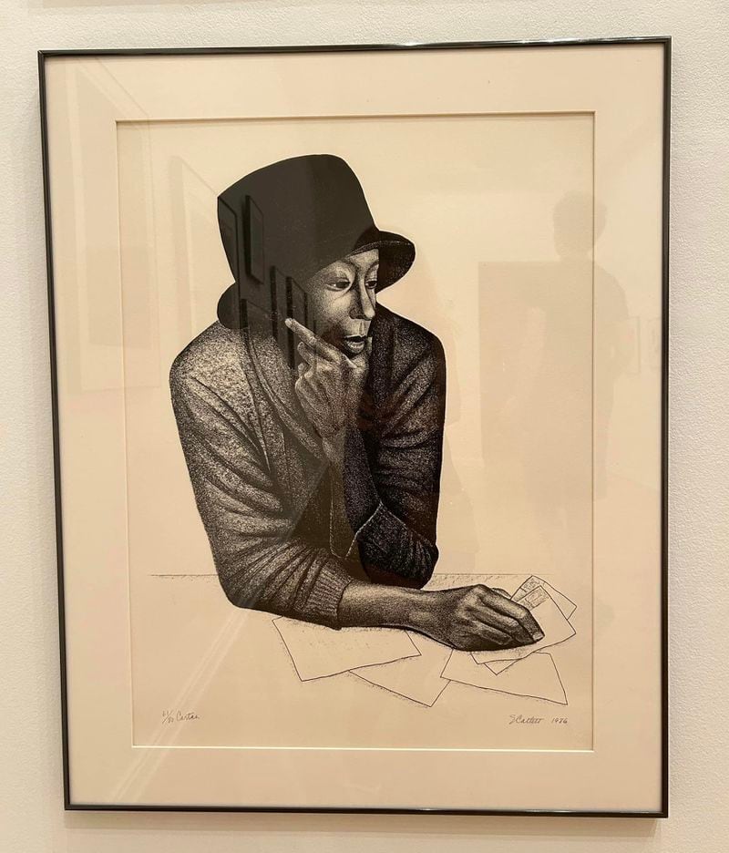 Among the Cochran collection is “Cartas” by Elizabeth Catlett. Lithograph on Arches woven paper, 1986. Portrait of Whoopi Goldberg playing the main character in the movie The Color Purple. 
(Courtesy of Wes Cochran)