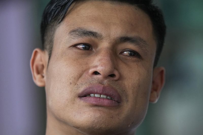 Wichan Seubsaichan, father of one of the victims of the school bus fire cries during an interview with the Associated Press at Wat Khao Phraya Sangkharam School, Lan Sak, Uthai Thani province, Thailand, Thursday, Oct. 3, 2024. (AP Photo/Sakchai Lalit)