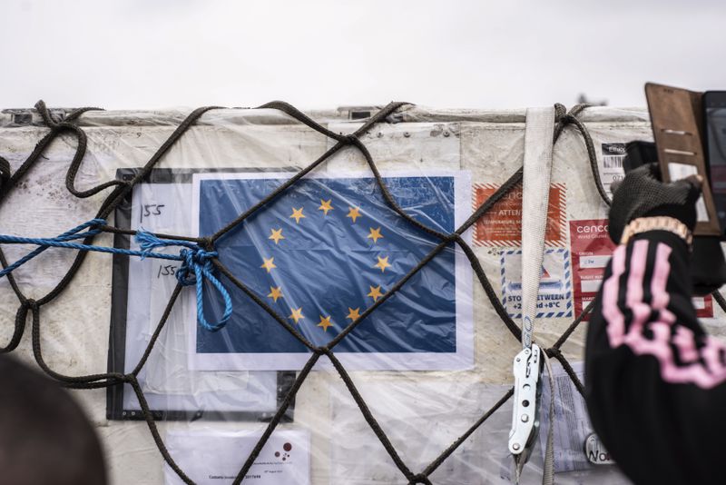 The European flag adorns a shipment of Mpox vaccine MVA-BN vaccine, manufactured by the Danish company Bavarian Nordic, as it is offloaded from a plane in Kinshasa, Congo, Thursday, Sept. 5, 2024. (AP Photo/Samy Ntumba Shambuyi)