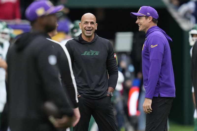 Minnesota Vikings head coach Kevin O'Connell, right, talks with New York Jets head coach Robert Saleh before an NFL football game, Sunday, Oct. 6, 2024, at the Tottenham Hotspur stadium in London. (AP Photo/Kirsty Wigglesworth)