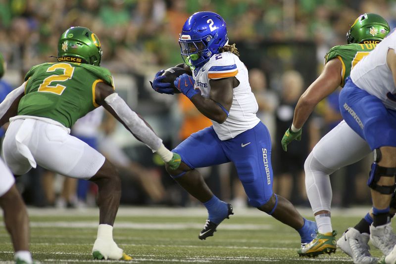 Boise State running back Ashton Jeanty (2) runs the ball during the first half of an NCAA college football game against Oregon, Saturday, Sept. 7, 2024, at Autzen Stadium in Eugene, Ore. (AP Photo/Lydia Ely)