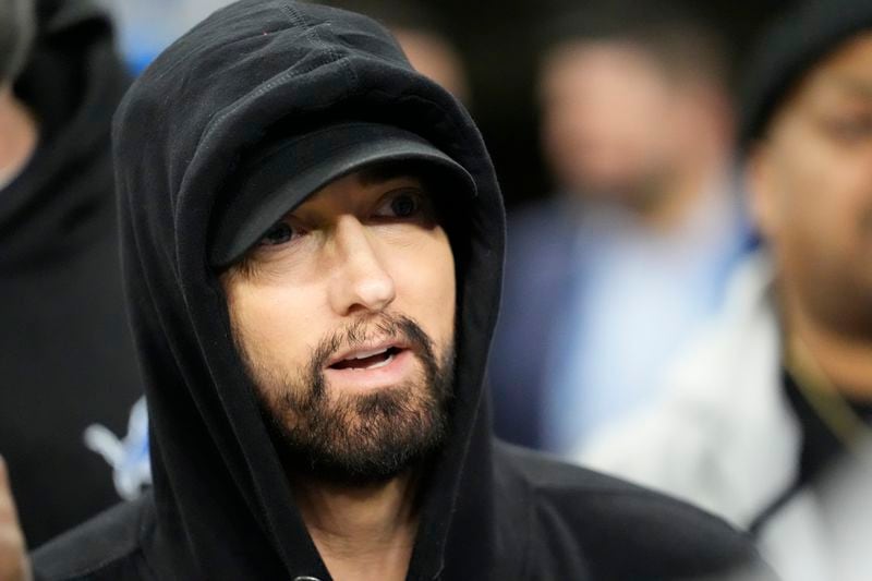 FILE - Eminem is seen during pregame of an NFL wild-card playoff football game, Jan. 14, 2024, in Detroit. (AP Photo/Paul Sancya, file)