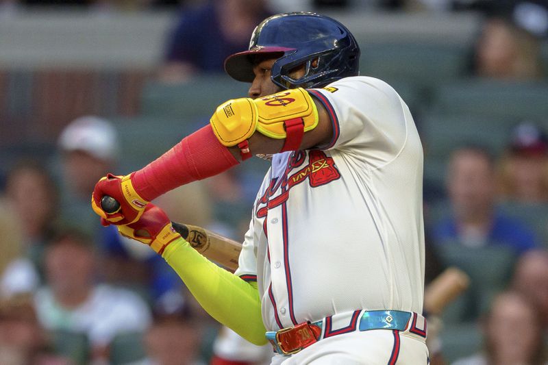 Atlanta Braves' Marcell Ozuna checks his swing in the first inning of a baseball game against the Los Angeles Dodgers, Sunday, Sept. 15, 2024, in Atlanta. (AP Photo/Jason Allen)