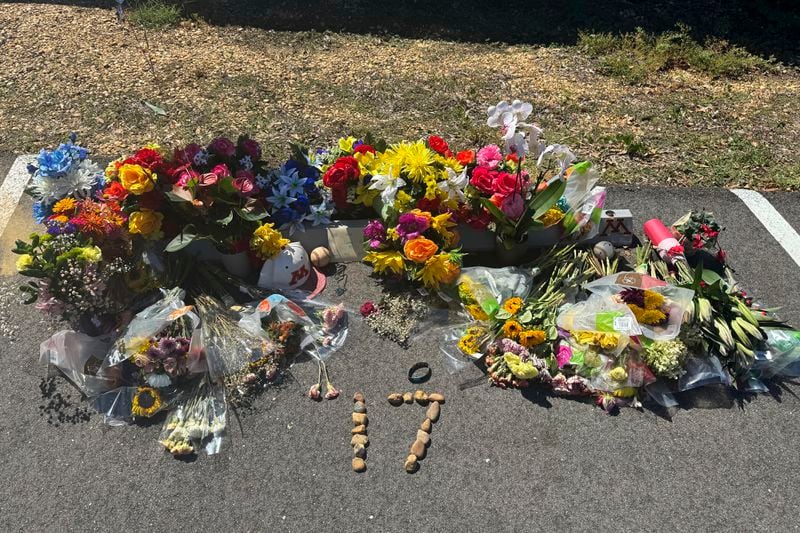 A memorial for 16-year-old Caden Tellier is seen in the parking lot of Morgan Academy in Selma, Ala., Monday, Aug. 26, 2024. (AP Photo/Safiyah Riddle)