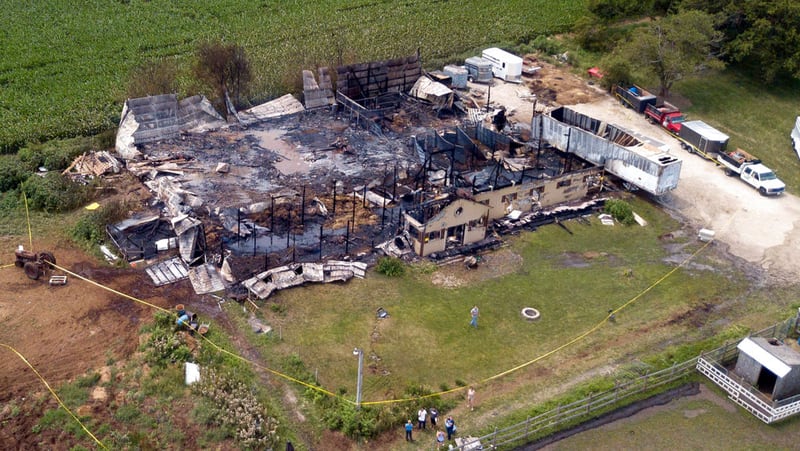 This Wednesday, July 5, 2017 photo shows the site where 18 horses died after a barn fire in Plainfield, Ill. Authorities say the horses died and two people were hurt after a morning blaze struck a horse-boarding barn in the southwestern Chicago suburbs. Plainfield Deputy Fire Chief Jon Stratton says 30 horses were in the barn when the fire started but a dozen survived because owners and firefighters were able to let them out. The cause of the blaze is under investigation. (Mark Welsh/Daily Herald via AP)