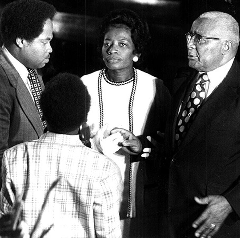 July 1974: Martin Luther King Sr. talks with his daughter, Christine, and her husband, Isaac Farris.