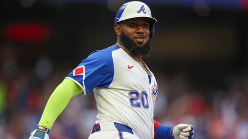 Atlanta Braves designated hitter Marcell Ozuna reacts after a two-run home run in the first inning of a baseball game against the Philadelphia Phillies, Saturday, July 6, 2024, in Atlanta. (AP Photo/Brett Davis)